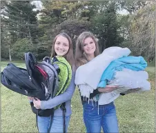  ?? COURTESY PHOTO ?? Kennett High School seniors Hailey Maurer, left, and Jenna Robertson unite on Oct. 14 with supplies collected for their ongoing Winter Drive to help others across the Northeast this winter. Both teens are members of the National Honors Society.