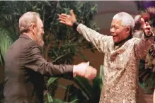  ??  ?? This file photo taken on Sept 02, 1998 shows South African President Nelson Mandela greeting Castro as he arrives for the opening of the 12th Non-Aligned Movement summit in Durban.