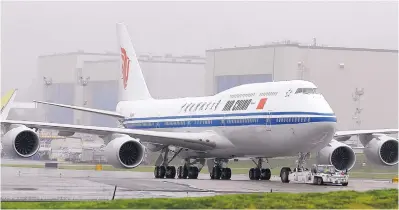  ?? TED S. WARREN/ASSOCIATED PRESS ?? The first Boeing 747-8 Interconti­nental airplane to be delivered to Air China is moved into position from Boeing’s assembly facility to Paine Field in Everett, Wash. China has smaller planes on its tariff list, but excluded Boeing’s big planes.