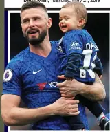  ?? REX ?? I’m the daddy: Giroud with son Evan at Stamford Bridge