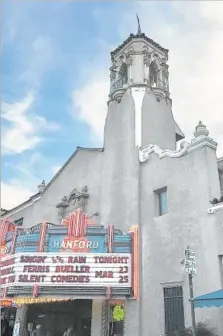  ?? Diana Marcum Los Angeles Times ?? THE MARQUEE advertises “Singin’ in the Rain” at the Fox Hanford theater in Hanford, a town with a guarded sense of optimism.