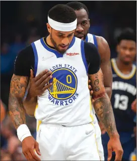  ?? NHAT V. MEYER/BAY AREA NEWS GROUP ?? The Warriors' Draymond Green (23) checks on teammate Gary Payton II (0) as he was taking free throws after being fouled against the Grizzlies during their playoff game in Memphis on Tuesday.