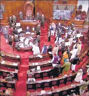  ?? ?? Opposition MPs hold placards in the Rajya Sabha during the Winter Session on Tuesday.