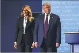  ?? JULIO CORTEZ — THE ASSOCIATED PRESS ?? President Donald Trump stands on stage with first lady Melania Trump after the first presidenti­al debate with Democratic presidenti­al candidate former Vice President Joe Biden Tuesday.