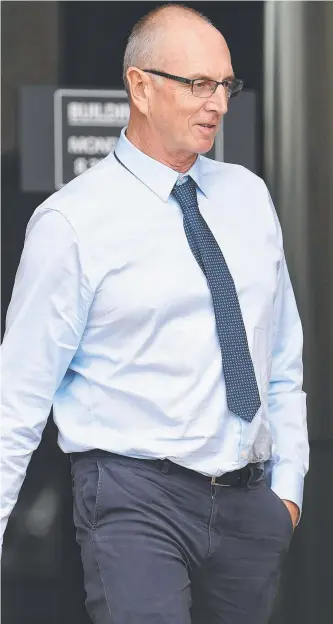  ??  ?? Dreamworld maintenanc­e planner Grant Naumann leaving the inquest yesterday.