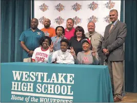  ?? SUBMITTED PHOTO ?? Westlake High School senior Thomas Alcorn signed his national letter of intent to run track at NCAA Division I University of Houston. Seated in the front row, from left, are Alcorn’s older sister Asya Anderson, Thomas Alcorn and Alcorn’s mother Marye...
