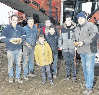  ?? PHOTO: TONY GAVIN ?? Food for thought: Brendan O’Gorman, far right, harvesting potatoes in Johnstown, Athy, with family members and employees.