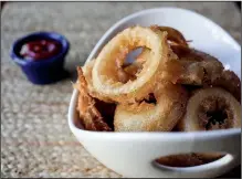  ?? Democrat-Gazette file photo/MITCHELL PE MASILUN ?? Beer Battered Onion Rings