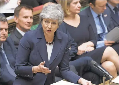  ??  ?? During a “somber” meeting with lawmakers in the House of Commons, British Prime Minister Theresa May on Wednesday said she’d resign from office if Brexit, the controvers­ial deal for Britain to divorce the European Union, goes through.