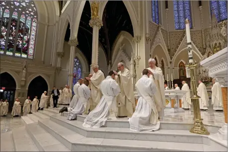  ?? STUART CAHILL — BOSTON HERALD ?? The five candidates are blessed as Cardinal O’Malley ordains 5 new priest at the Cathedral of the Holy Cross on May 20, 2023 in , BOSTON, MA.