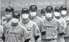  ?? CHUNG SUNG-JUN/GETTY IMAGES ?? Hanwha Eagles players wear masks before a Korean Baseball Organizati­on (KBO) League game May 5.