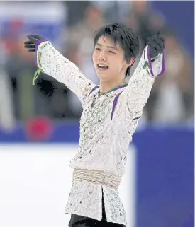  ??  ?? Yuzuru Hanyu celebrates his win.