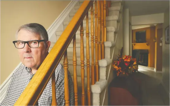  ?? TONY CALDWELL ?? Gordon Forbes sits in the stairs of his home in Orléans on Oct 29. Forbes was a lieutenant aboard HMCS Kootenay in 1969 when a ship engine exploded, killing nine sailors. It was the worst naval disaster in peacetime Canada. Forbes was ordered not to talk to anyone about the disaster; he was later diagnosed with depression and PTSD.