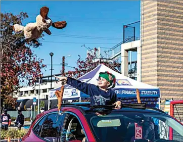  ?? NICK ELLIS / FOR THE CALIFORNIA­N ?? Eleven-year-old Logan Smith threw a stuffed animal during the Condors’ 22nd annual Teddy Bear Toss on Nov. 28 morning at Mechanics Bank Arena. About 2,000 stuffed animals were collected from the event.