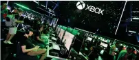  ?? — AP ?? Gamers interact with newly-announced games and experience­s at Xbox E3 2018 Showcase in Los Angeles on Sunday.