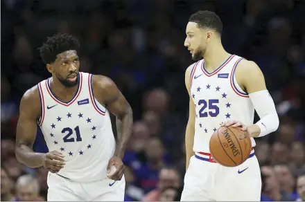  ?? THE ASSOCIATED PRESS FILE ?? The 76ers’ Joel Embiid (21) talks with Ben Simmons (25) during a game against Oklahoma City in 2019, at the Wells Fargo Center.