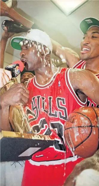  ?? SCOTT TROYANOS/AP ?? Hall of Famers Michael Jordan and Scottie Pippen would go on to pull off two three-peats. This celebratio­n is from the 1993 Finals after they beat the Suns in six games to complete their first three-peat.