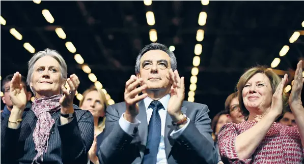  ??  ?? François Fillon, who represents ‘Gallic Thatcheris­m’, and his wife, Penelope, left