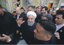  ?? Reuters ?? Iranian President Hassan Rouhani visits the shrine of Imam Ali in Najaf, Iraq, yesterday