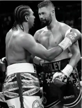  ??  ?? RAW EMOTION: Haye congratula­tes Bellew after being halted in round five