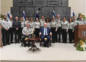 ?? (Mark Neyman/GPO) ?? PRESIDENT REUVEN RIVLIN hosts military judges, including Brig.-Gen. Doron Peles, president of the Military Court of Appeals (seated at left), in the capital on Thursday.