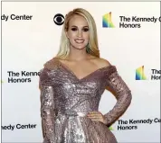  ?? PHOTO BY GREG ALLEN/INVISION/AP, FILE ?? Carrie Underwood attends the 42nd Annual Kennedy Center Honors in Washington on Dec. 8, 2019. Underwood released her first album of gospel music called “My Savior,” on Friday, March 26.