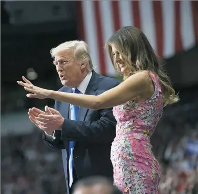  ?? Rebecca Droke/Post-Gazette ?? President Donald Trump and his wife, Melania, greet the crowd Tuesday at the start of his “Make America Great Again” rally at the Covelli Centre in Youngstown, Ohio.