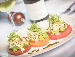  ??  ?? Heirloom tomato, crab and avocado stack at Ocean 44 in Scottsdale.