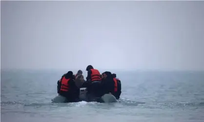  ?? Photograph: Gonzalo Fuentes/Reuters ?? A group of migrants on an inflatable dinghy leave Wimereux in France to cross the English Channel, 24 November 2021.