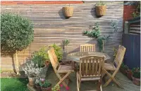  ??  ?? Seating area The raised deck was already here when we moved in, but by adding plant pots and planters, we created a place to sit. It makes an ideal, tranquil spot for al fresco dining and a chill-out area.