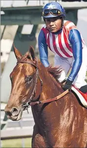  ?? Benoit Photo ?? DORTMUND and jockey Martin Garcia took the lead immediatel­y en route to winning by 4 1 ⁄2 lengths.