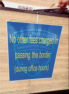  ??  ?? New rule: A notice at an immigratio­n counter at the Sadao Arrival Boundary Post in Danok, southern Thailand.