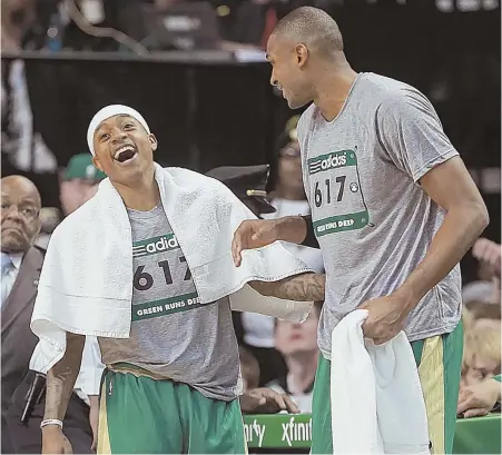  ?? STAFF PHOTO BY MATT STONE ?? HAPPY DAZE: Isaiah Thomas and Al Horford joke around after the Celtics beat the Timberwolv­es last night at the Garden.
