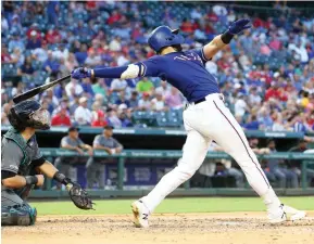  ?? AP Photo/Richard W. Rodriguez, File ?? ■ Texas Rangers’ Joey Gallo follows through on a solo home run in the fourth inning against the Arizona Diamondbac­ks on July 16, 2019, in Arlington, Texas.