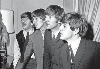  ?? Associated Press ?? BEATLES — Ringo Starr, left, George Harrison, John Lennon and Paul McCartney — prepare to conquer U.S.