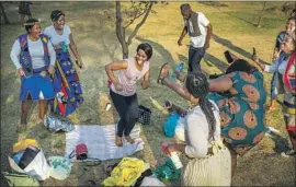  ?? Jerome Delay Associated Press ?? PEOPLE celebrate South Africa’s Heritage Day by dancing to the song “Jerusalema” at Zoo Lake Park in Johannesbu­rg. The tune has become a worldwide hit.