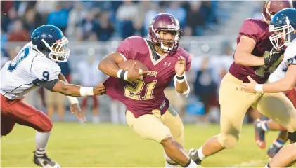  ?? APRIL GAMIZ / THE MORNING CALL ?? Whitehall’s Saquon Barkley runs with the ball against Liberty’s Ryan Lawrence (9) during a Sept. 19, 2014 game at Whitehall High School.