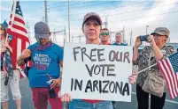  ?? OLIVIER TOURON AFP VIA GETTY IMAGES ?? Supporters of U.S. President Donald Trump gather to protest outside the Maricopa County Election Department in Phoenix.