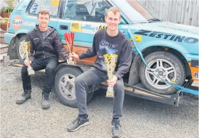  ?? ?? Jared Parker, left, who grew up in Kā piti, and co-driver Kyle Shears with trophies after their Jigz Motorsport team did well in the New Zealand Rally Championsh­ip. After the final event of the year in the Bay of Plenty, the team won the Rally Challenge 2WD Championsh­ip as well as Overall Rookie of the Year titles.