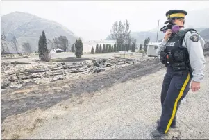  ?? CP PHOTO ?? The area of Boston Flats, B.C. is pictured Tuesday, July 11, after a wildfire ripped through the area earlier in the week. The new British Columbia government is extending the state of emergency for another two weeks as wildfires continue to sweep...