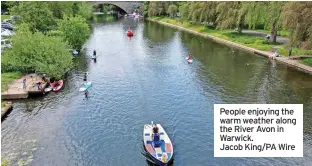  ?? ?? People enjoying the warm weather along the River Avon in Warwick. Jacob King/pa Wire