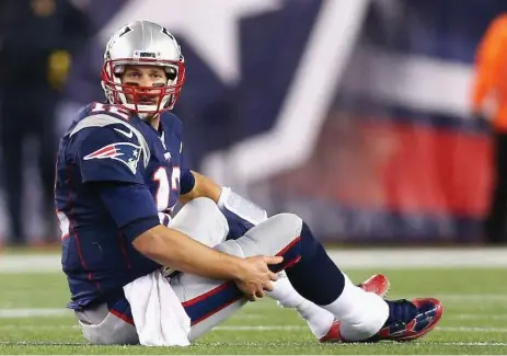  ?? MADDIE MEYER/GETTY IMAGES ?? Patriots quarterbac­k Tom Brady dodges questions about concussion­s, but his wife Gisele Bundchen says he suffered one last season.