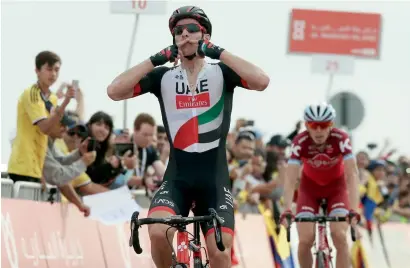  ?? Supplied photo ?? Rui Alberto Costa of the UAE Team celebrates after crossing the finish line in the third stage of the Abu Dhabi Tour. —