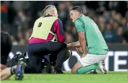  ?? GETTY IMAGES ?? Johnny Sexton of Ireland receives medical attention during the test against the All Blacks at Eden Park.