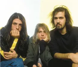  ?? AJ BARRATT/UPPA 1992 ?? Drummer Dave Grohl, from left, singer and guitarist Kurt Cobain and bassist Krist Novoselic of Nirvana.