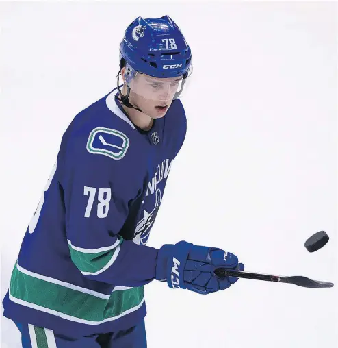 ?? PHOTOS: GERRY KAHRMANN/PNG FILES ?? Vancouver Canucks forward prospect Kole Lind has had a rough introducti­on to pro hockey as a member of the American Hockey League’s Utica Comets, but has worked his way up to the third line.
