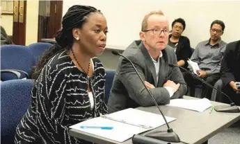  ?? | FRAN SPIELMAN/ SUN- TIMES ?? City Chief Financial Officer Carole Brown ( left) and Ald. Tom Tunney testify at a hearing Thursday about surge pricing for street parking around Wrigley Field.