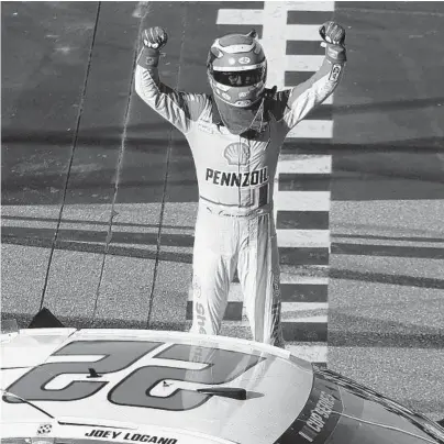  ?? CHRIS GRAYTHEN/GETTY ?? Joey Logano celebrates in victory lane at Phoenix Raceway. It was his 25th career Cup win.