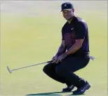  ?? GETTY IMAGES ?? Tiger Woods, reacting to a missed putt on No. 3, is tied for 84th after Thursday’s first round of the Farmers Insurance Open. Tony Finau leads by one stroke after shooting a 7-under 65.