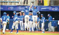  ?? (Margo Sugarman/Israel Baseball Associatio­n) ?? TEAM ISRAEL players celebrate after scoring during an Olympic qualificat­ion game.